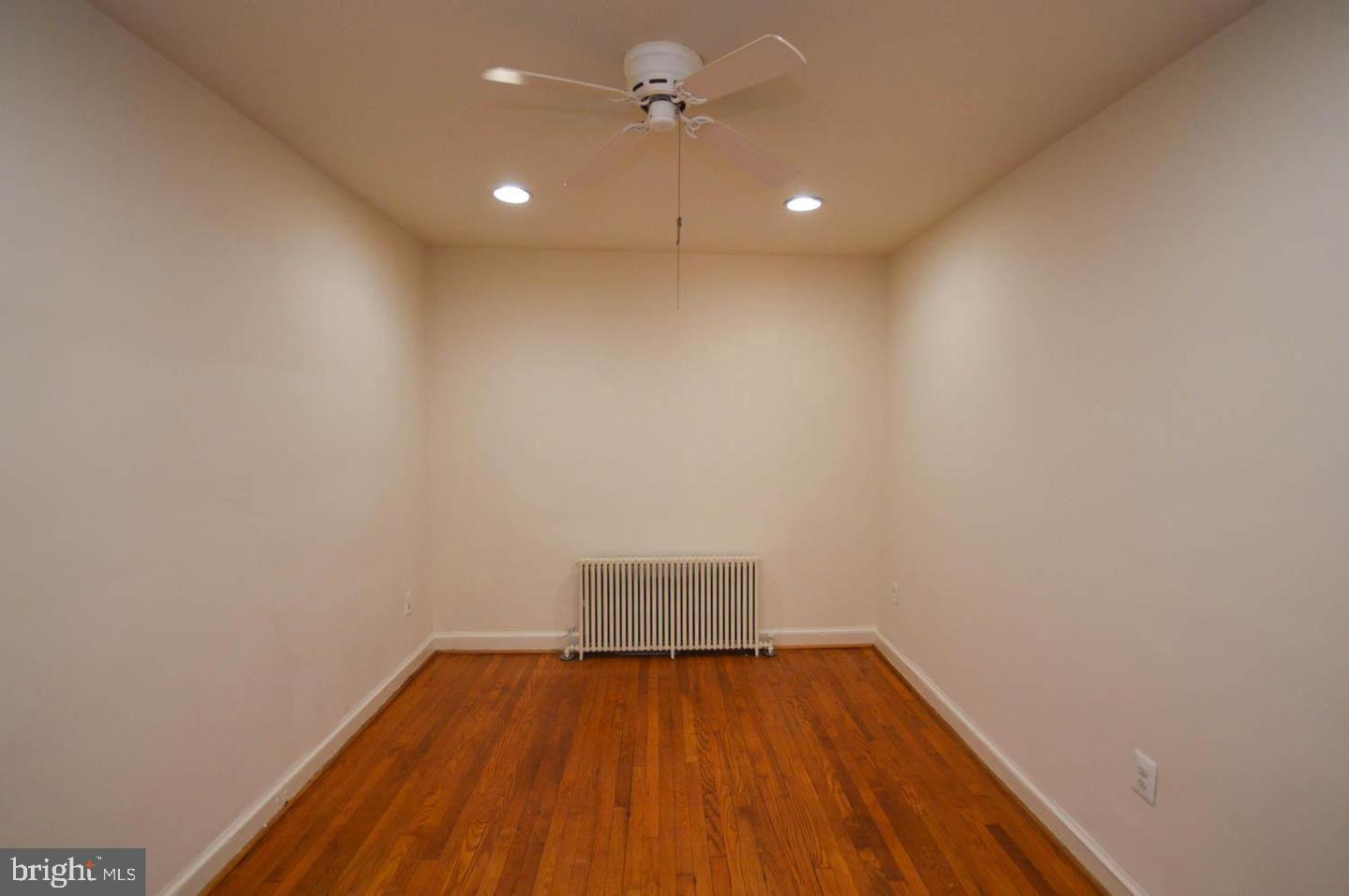 1722 T Street Southeast Washington, DC 20020 - Photo 14 of 23 a view of empty room with wooden floor and fan