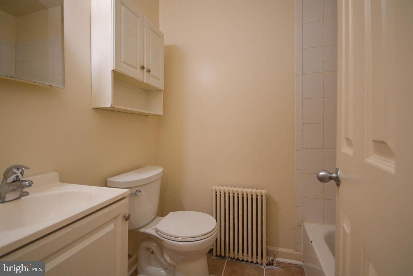 1722 T Street Southeast Washington, DC 20020 - Photo 15 of 23 a bathroom with a sink toilet and a mirror