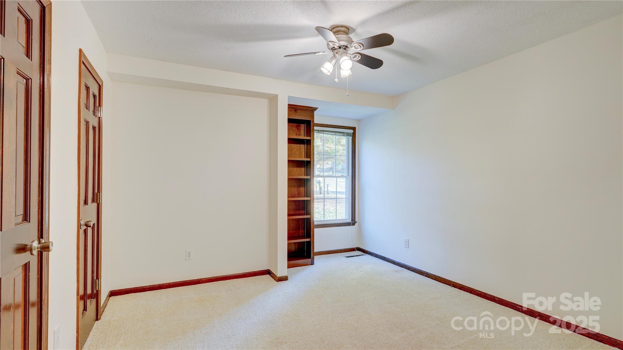1535 Cripple Creek Road Kannapolis, NC 28081 - Photo 13 of 40 an empty room with a empty space and windows