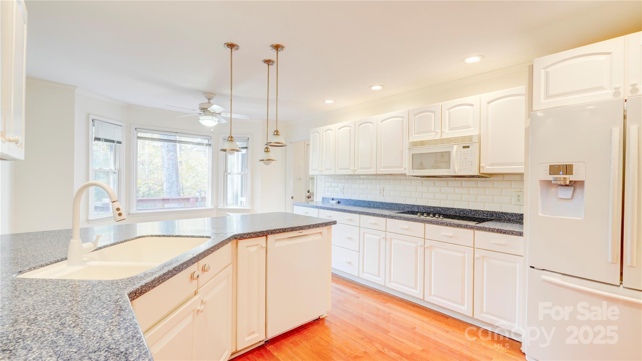 1535 Cripple Creek Road Kannapolis, NC 28081 - Photo 16 of 40 a large kitchen with granite countertop a sink a counter top space and cabinets