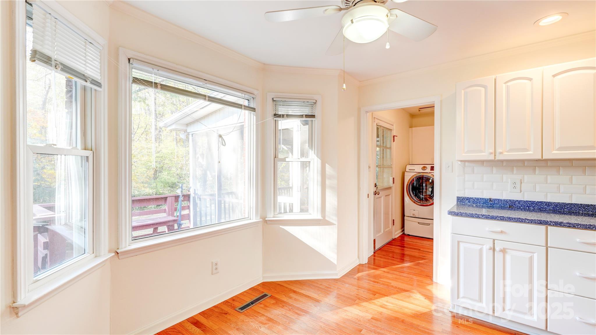 1535 Cripple Creek Road Kannapolis, NC 28081 - Photo 19 of 40 a view of a kitchen with a sink and dishwasher with wooden floor