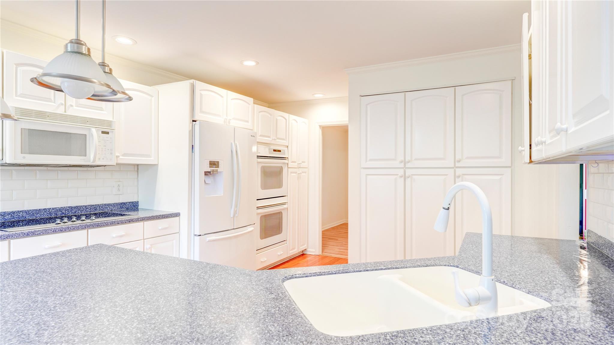 1535 Cripple Creek Road Kannapolis, NC 28081 - Photo 3 of 40 a view of a kitchen with a sink and cabinets