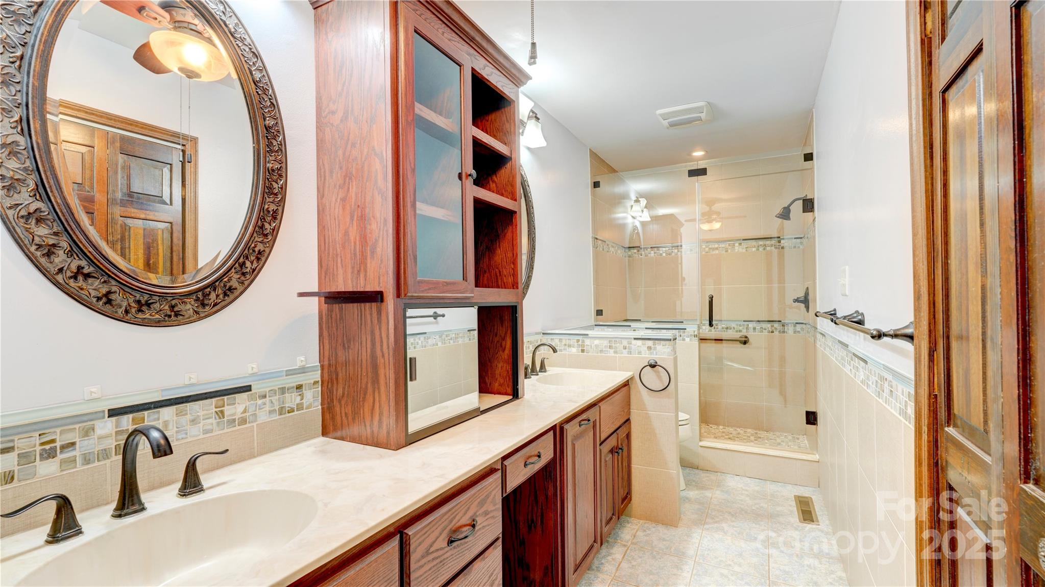 1535 Cripple Creek Road Kannapolis, NC 28081 - Photo 4 of 40 a spacious bathroom with a sink a mirror a bathtub and shower