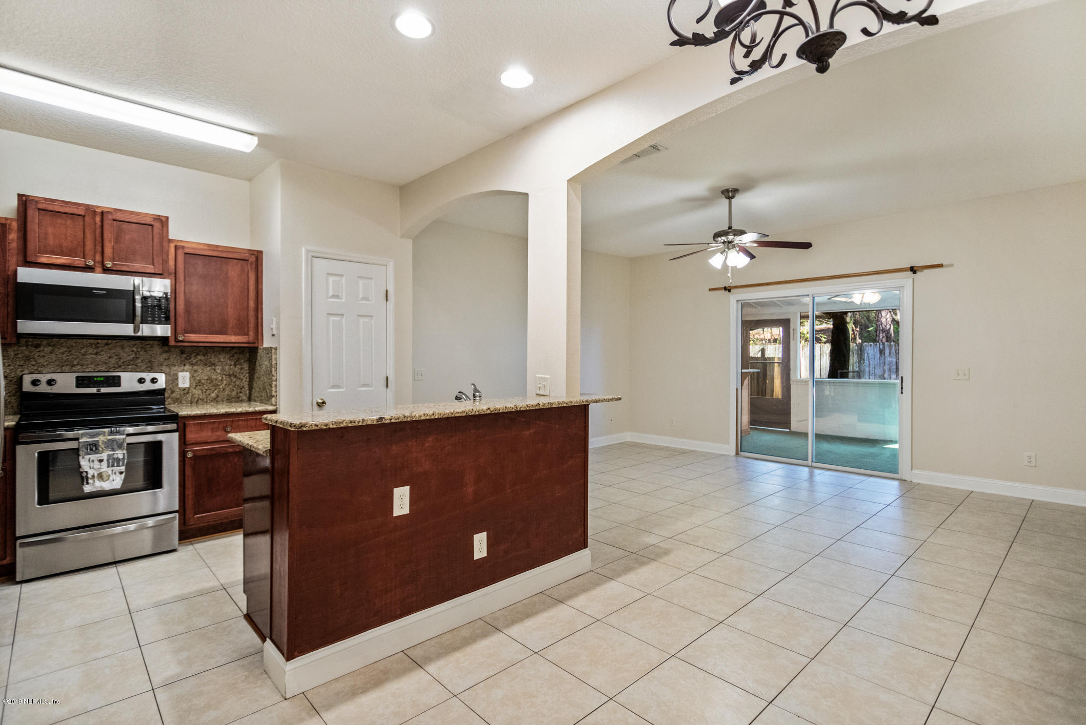 4685 Barnes Road South Jacksonville, FL 32207 - Photo 12 of 29 a kitchen with stainless steel appliances granite countertop a refrigerator and a stove top oven