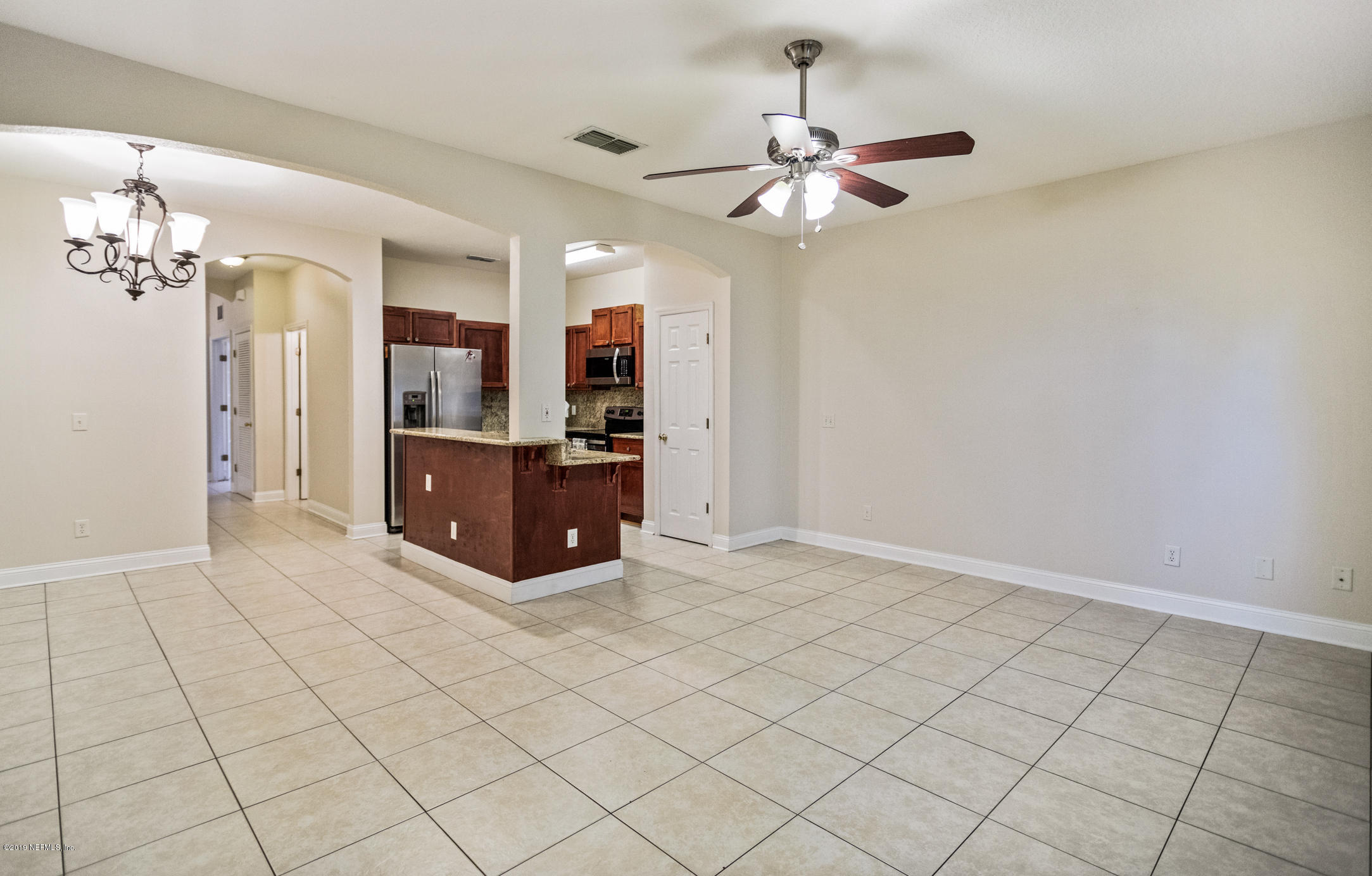 4685 Barnes Road South Jacksonville, FL 32207 - Photo 13 of 29 a view of a kitchen with furniture and an empty room