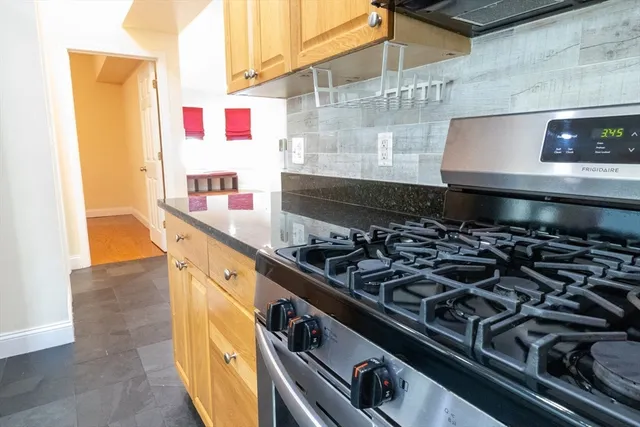 a kitchen with a stove and a microwave
