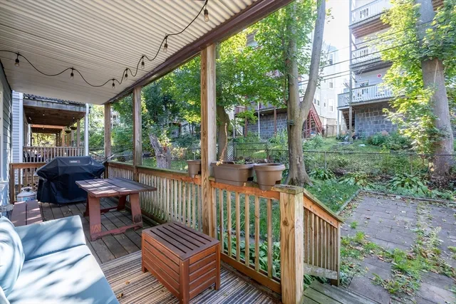 a view of a chair and tables in the deck
