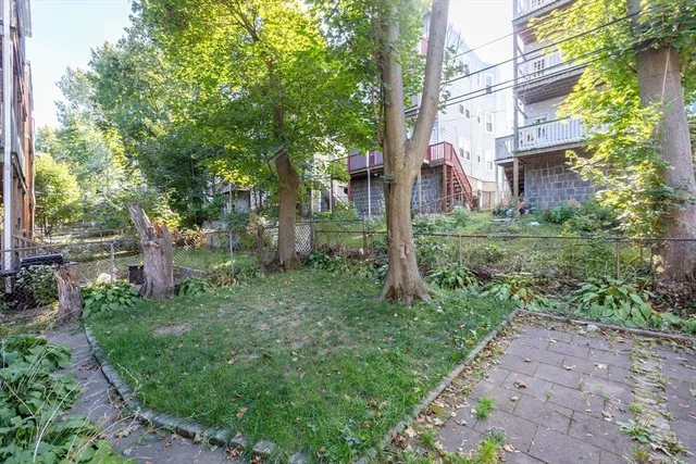 a backyard of a house with lots of green space