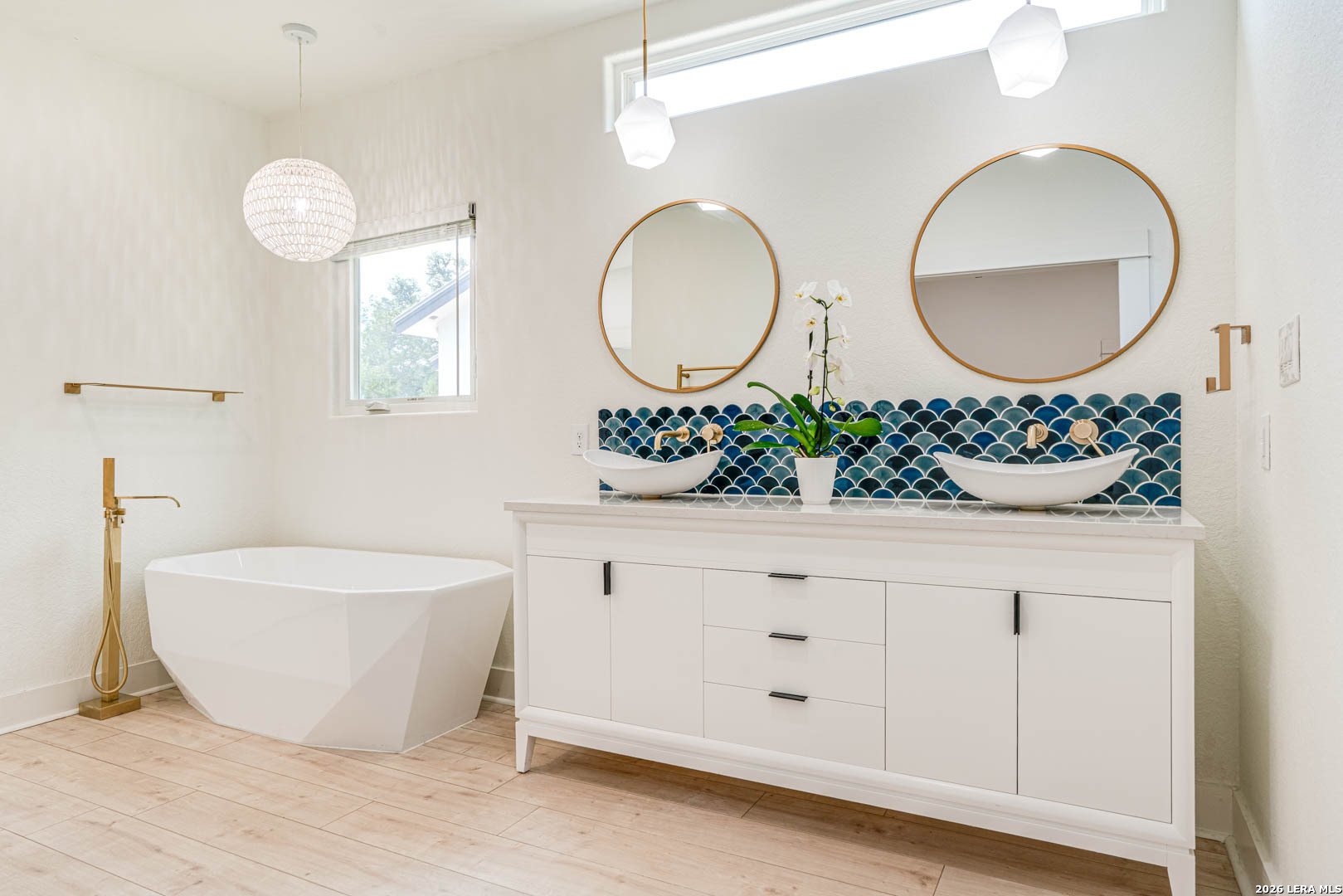 316 Prairie Tea Lane Spring Branch, TX 78070 - Photo 18 of 38 a bathroom with a double vanity sink and a mirror
