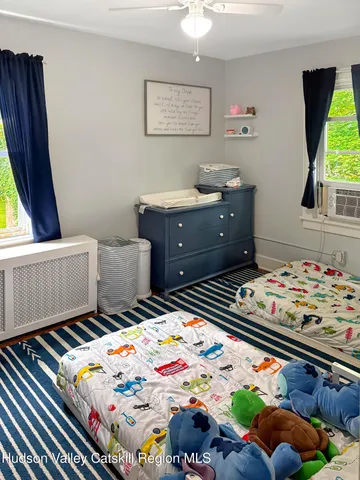 a bedroom with bed and window