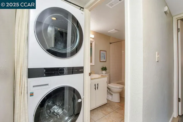 a view of a hallway with washer and dryer