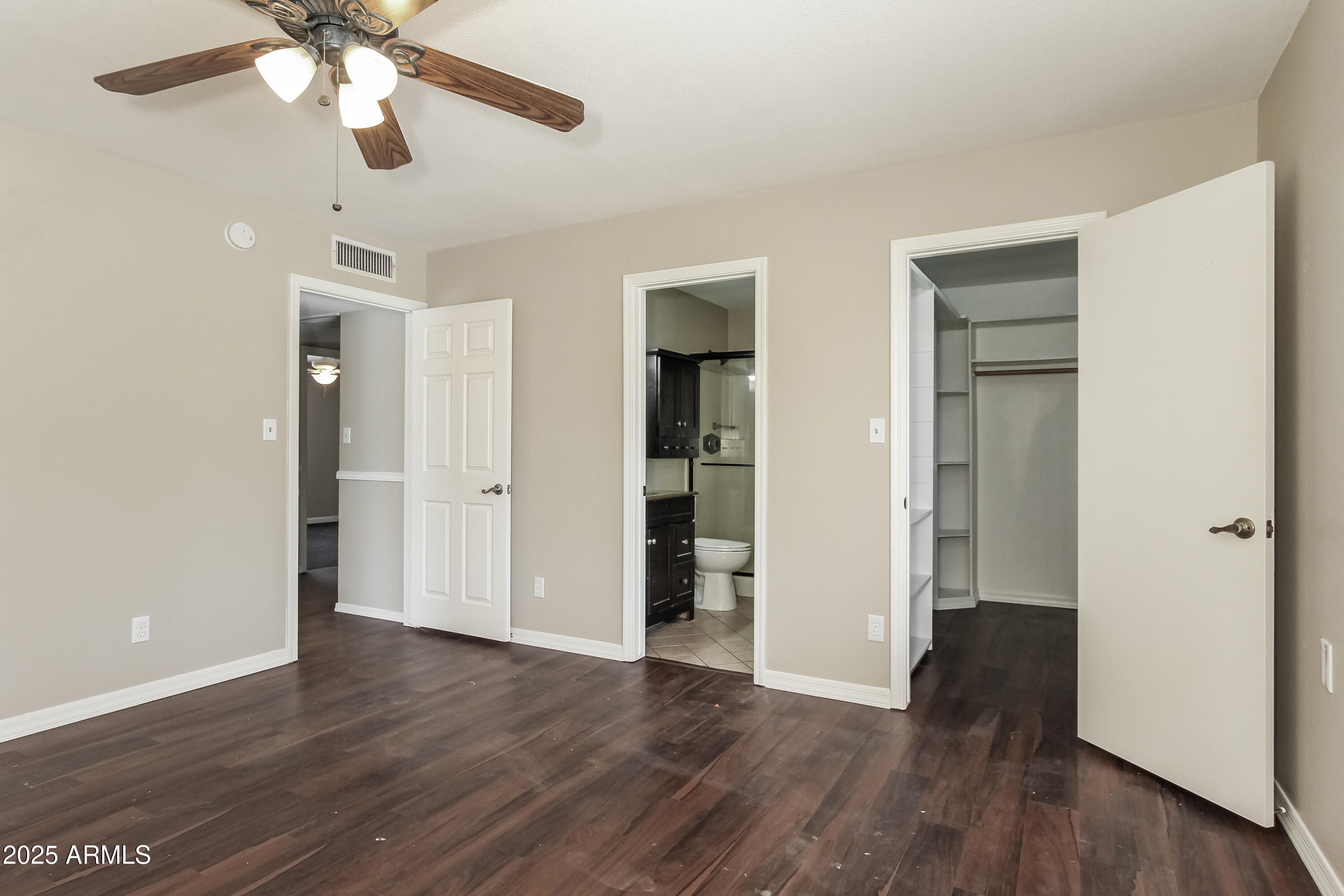 2839 West Wagoner Road Phoenix, AZ 85053 - Photo 14 of 15 a view of an empty room with wooden floor