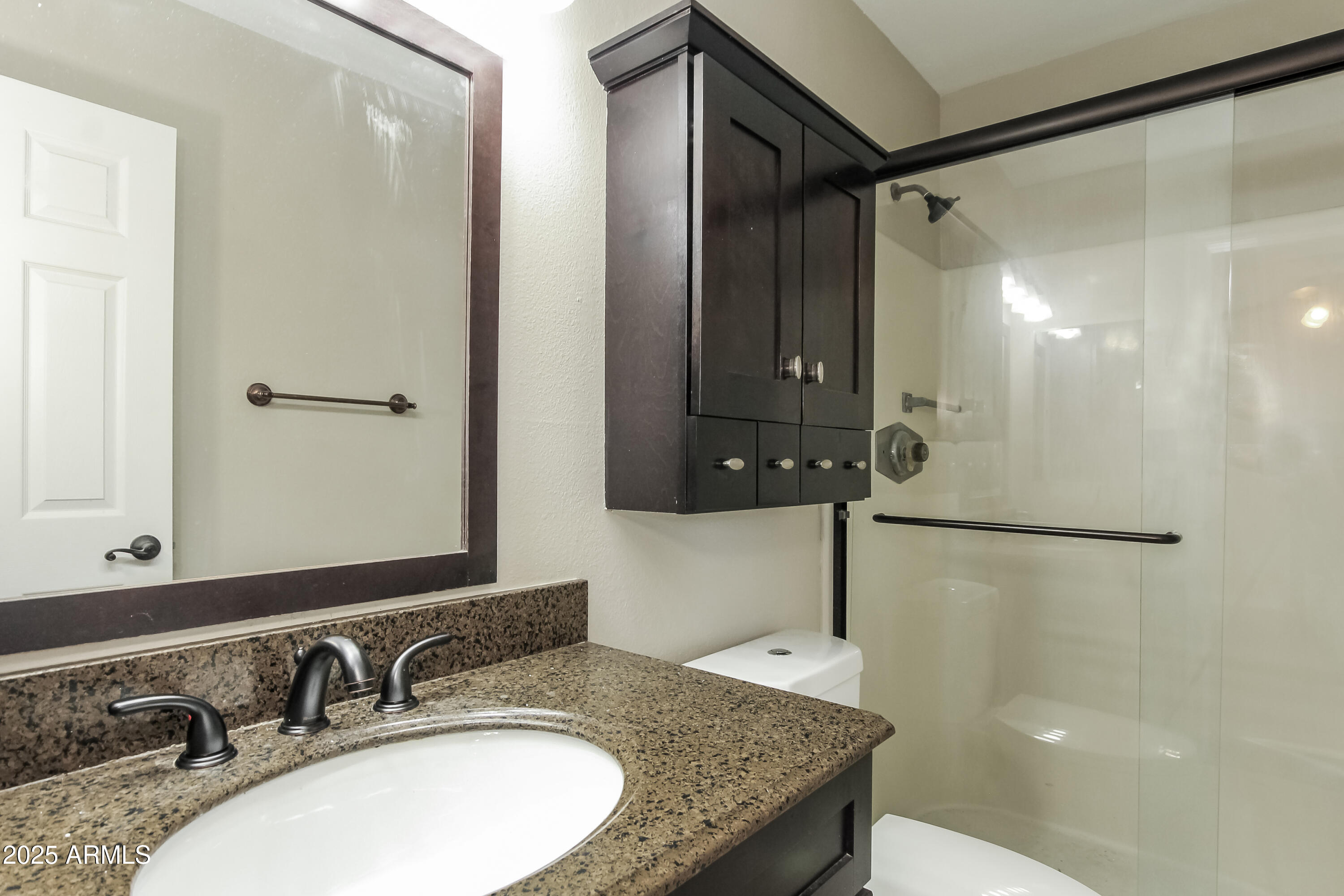 2839 West Wagoner Road Phoenix, AZ 85053 - Photo 9 of 15 a bathroom with a sink and a mirror