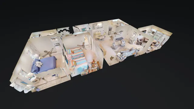 a bed sitting in a bedroom next to a lamp