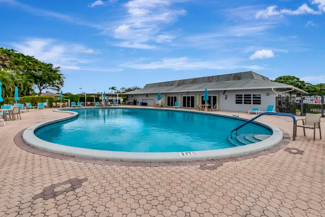 a view of a swimming pool with a patio