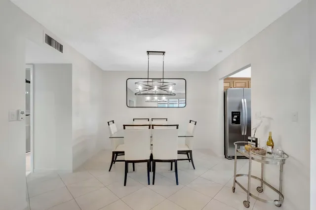 a view of a dining room with furniture and window