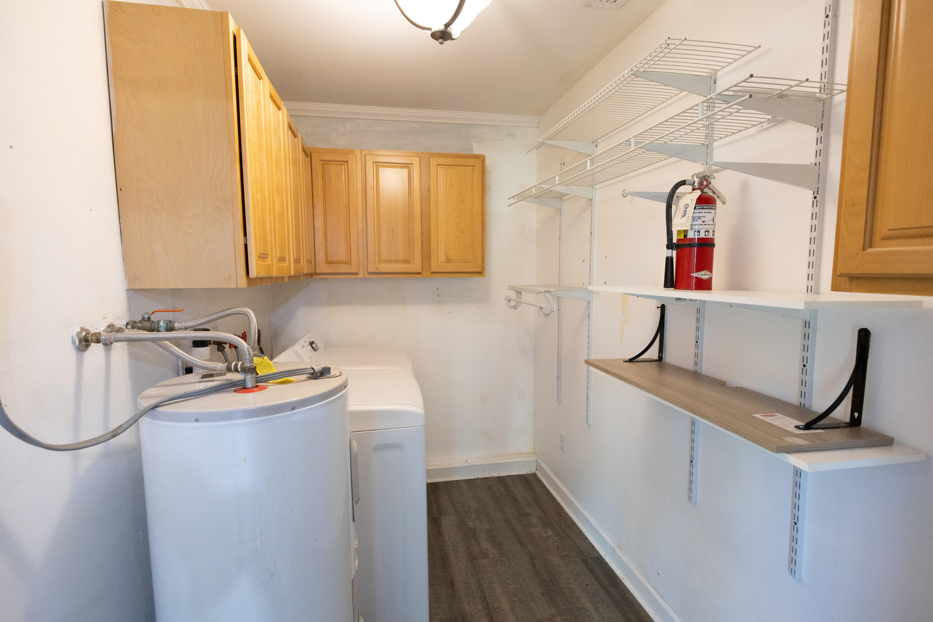 1914 Southwest Beauregard Street Port St. Lucie, FL 34953 - Photo 13 of 23 a view of storage and utility room with washer and dryer
