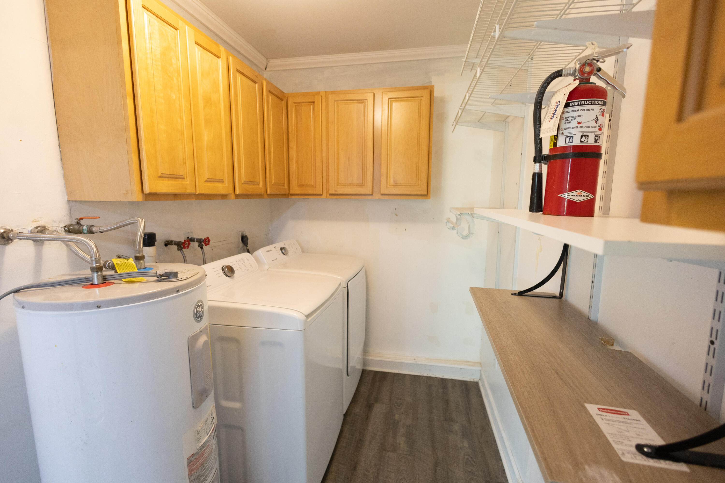 1914 Southwest Beauregard Street Port St. Lucie, FL 34953 - Photo 14 of 23 a utility room with dryer and washer