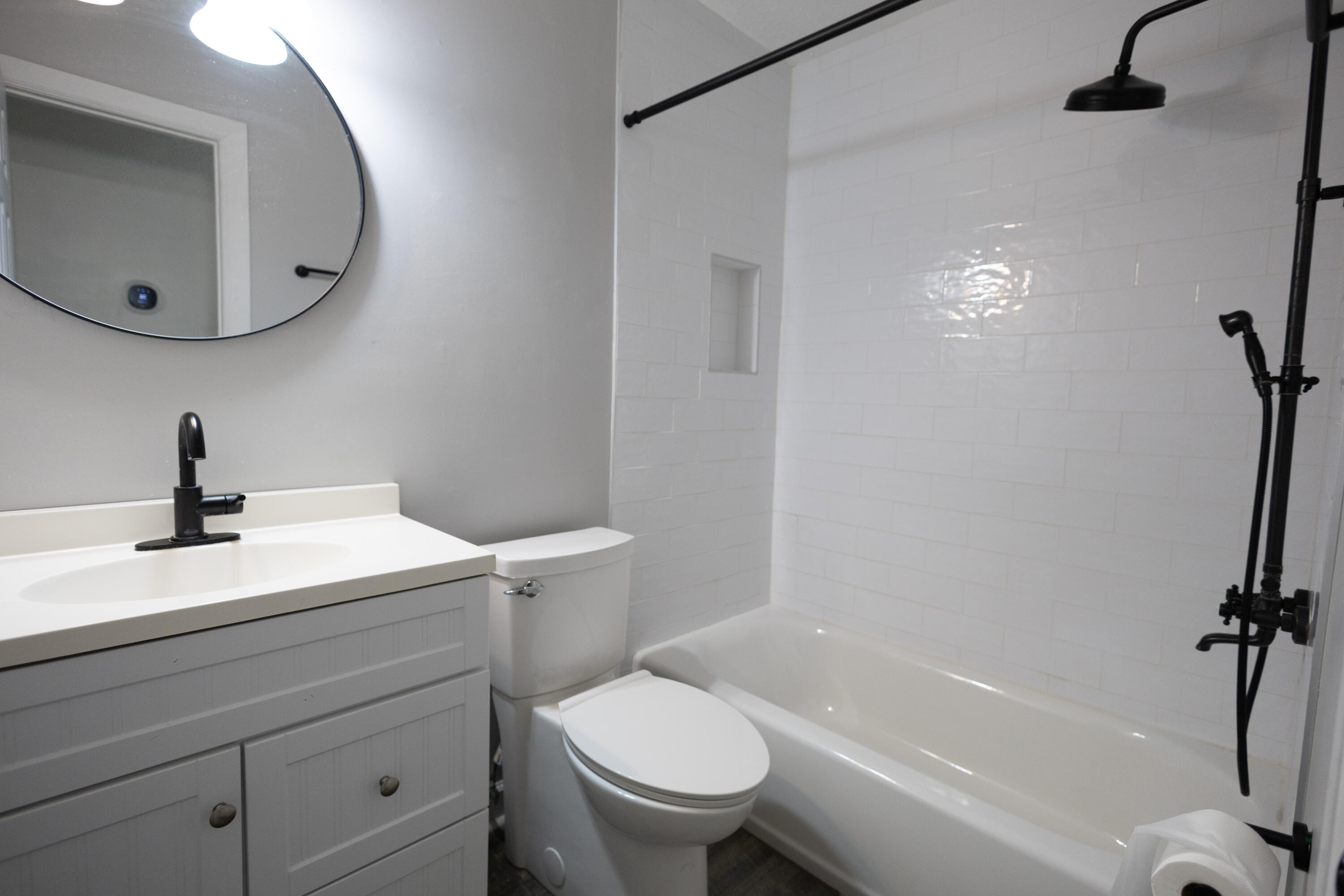 1914 Southwest Beauregard Street Port St. Lucie, FL 34953 - Photo 18 of 23 a bathroom with a sink a toilet and a mirror