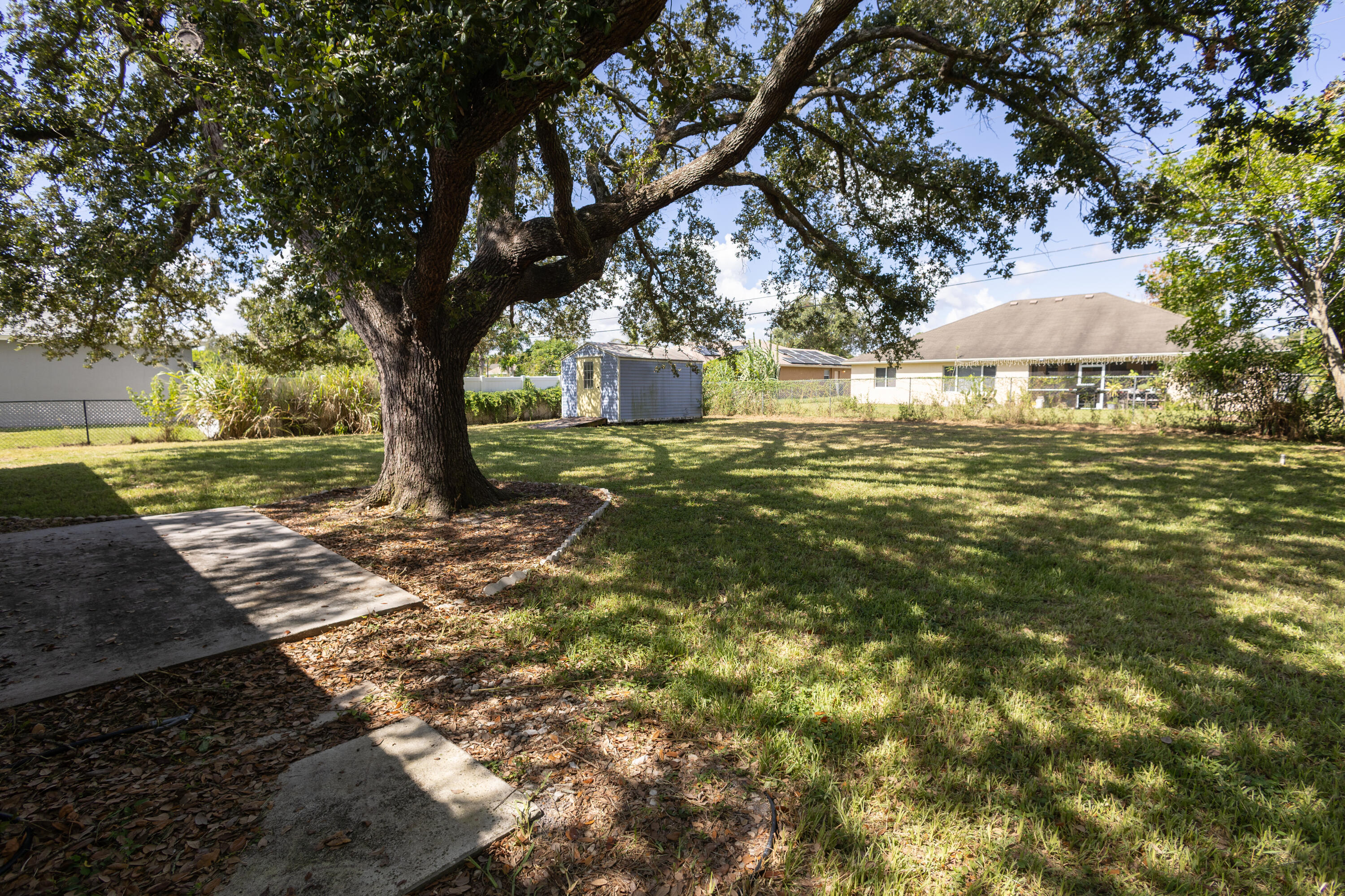 1914 Southwest Beauregard Street Port St. Lucie, FL 34953 - Photo 2 of 23 a view of a trees in a yard with large trees