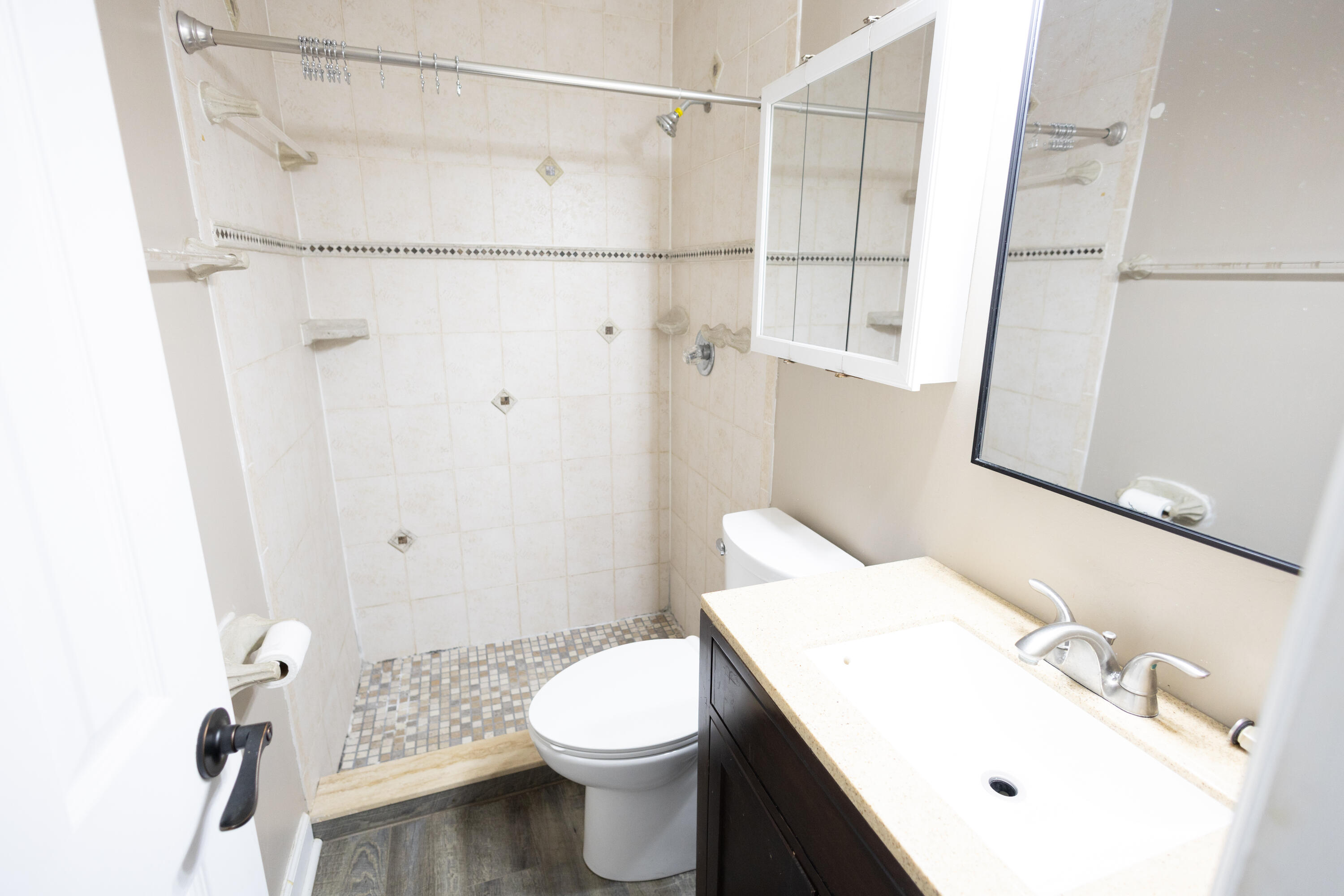 1914 Southwest Beauregard Street Port St. Lucie, FL 34953 - Photo 23 of 23 a bathroom with a sink a toilet and shower