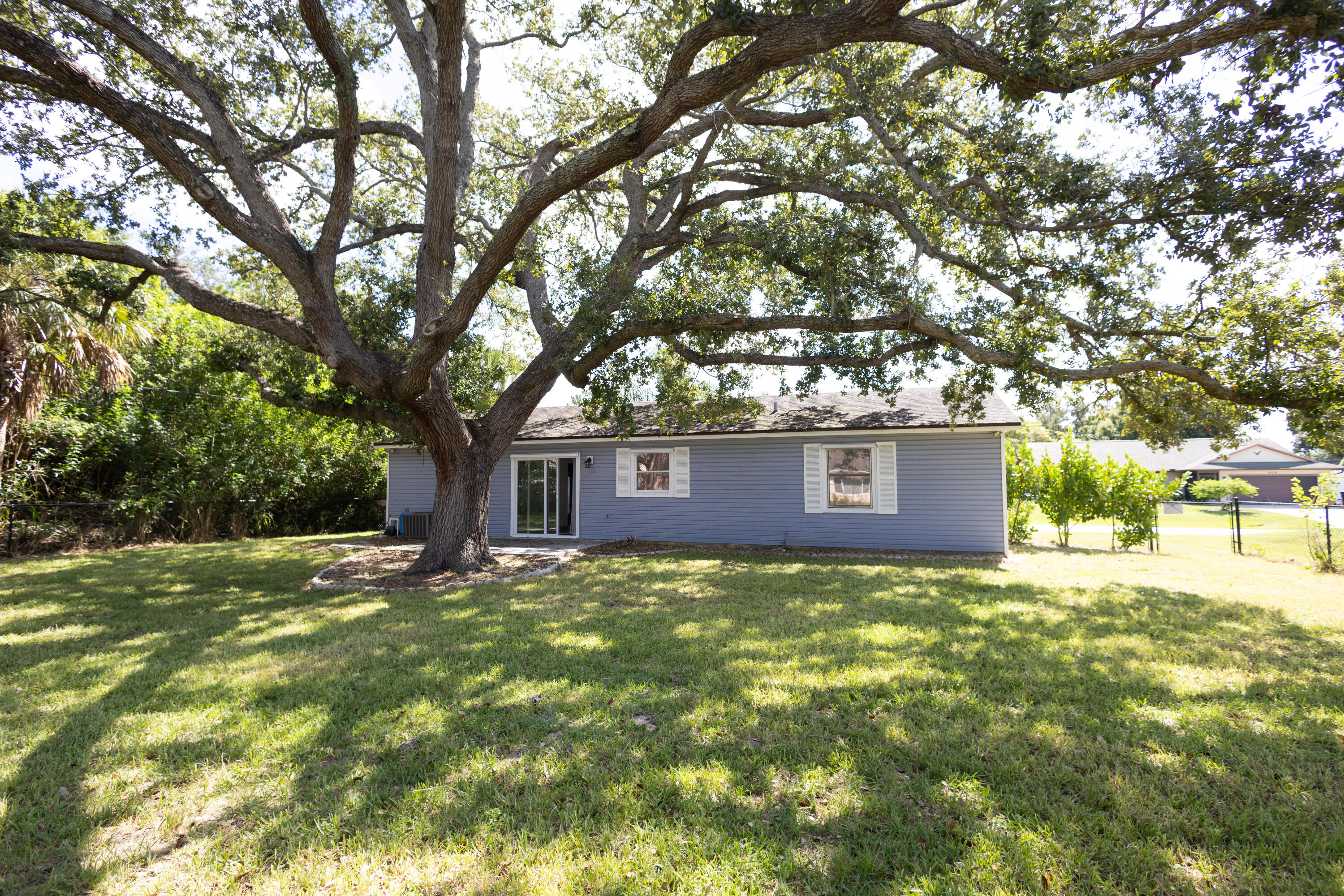 1914 Southwest Beauregard Street Port St. Lucie, FL 34953 - Photo 4 of 23 a view of a house with a yard