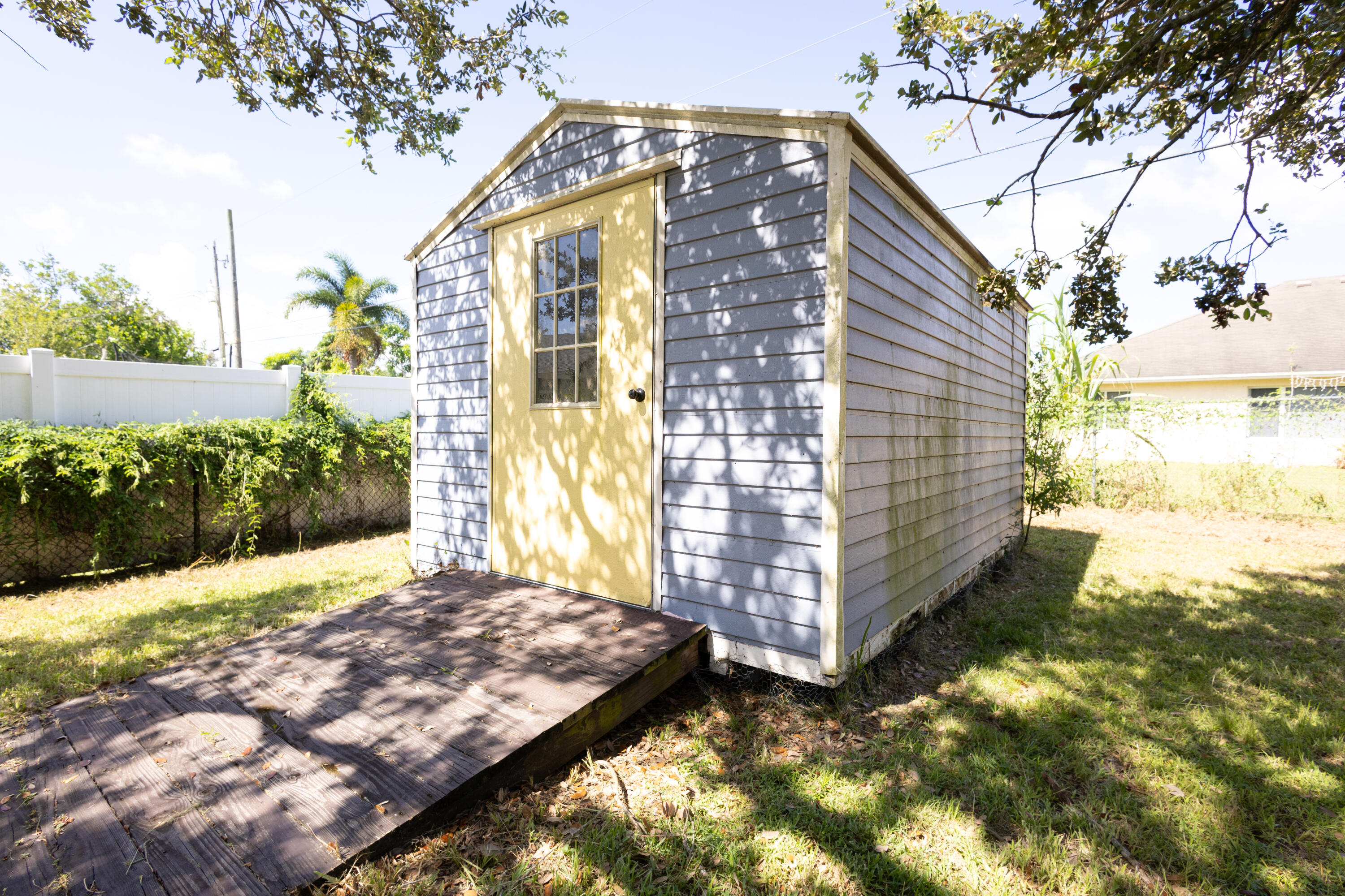 1914 Southwest Beauregard Street Port St. Lucie, FL 34953 - Photo 5 of 23 a view of a backyard with pathway