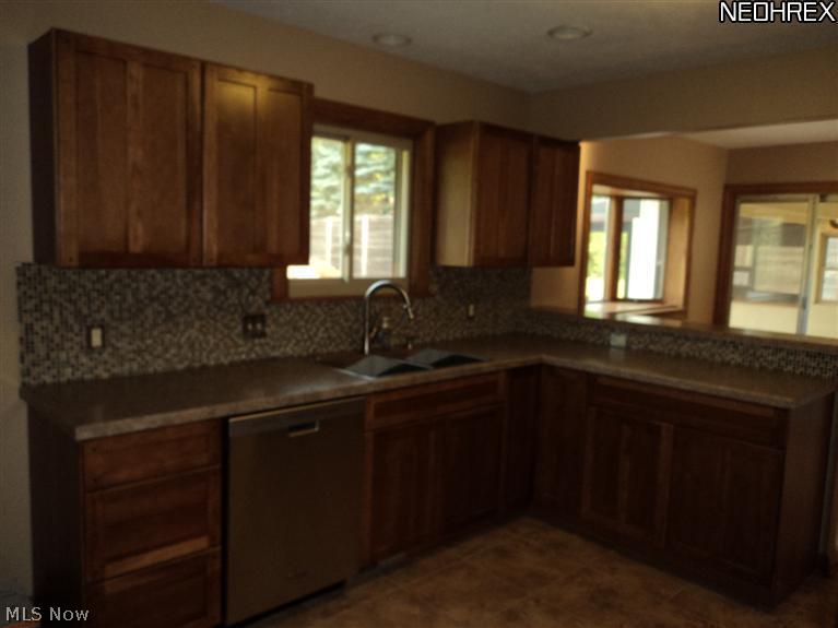 5690 Beach Road Medina, OH 44256 - Photo 2 of 14 BRAND NEW KITCHEN WITH CERAMIC FLOORING AND 8K STAINLESS STEEL APPLIANCE PACKAGE.
