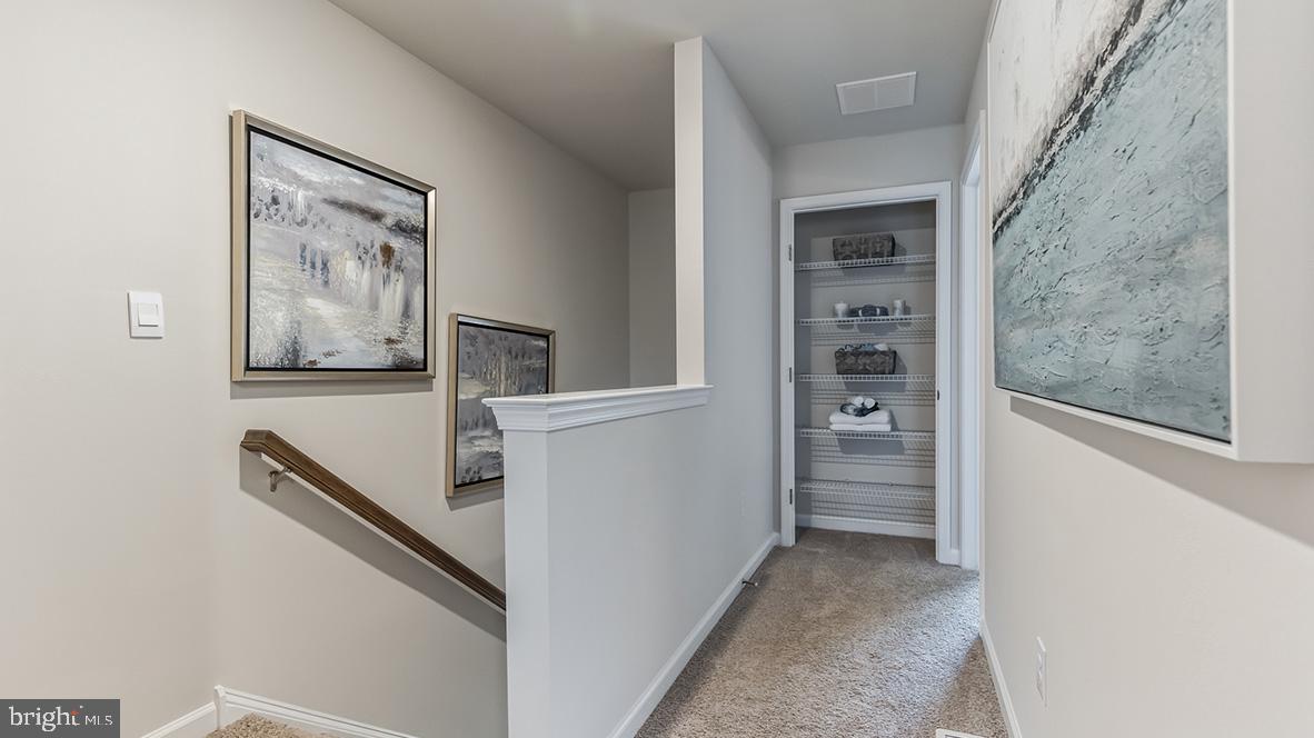1162 Martin Road Breinigsville, PA 18031 - Photo 14 of 25 a view of a hallway with closet and cabinet