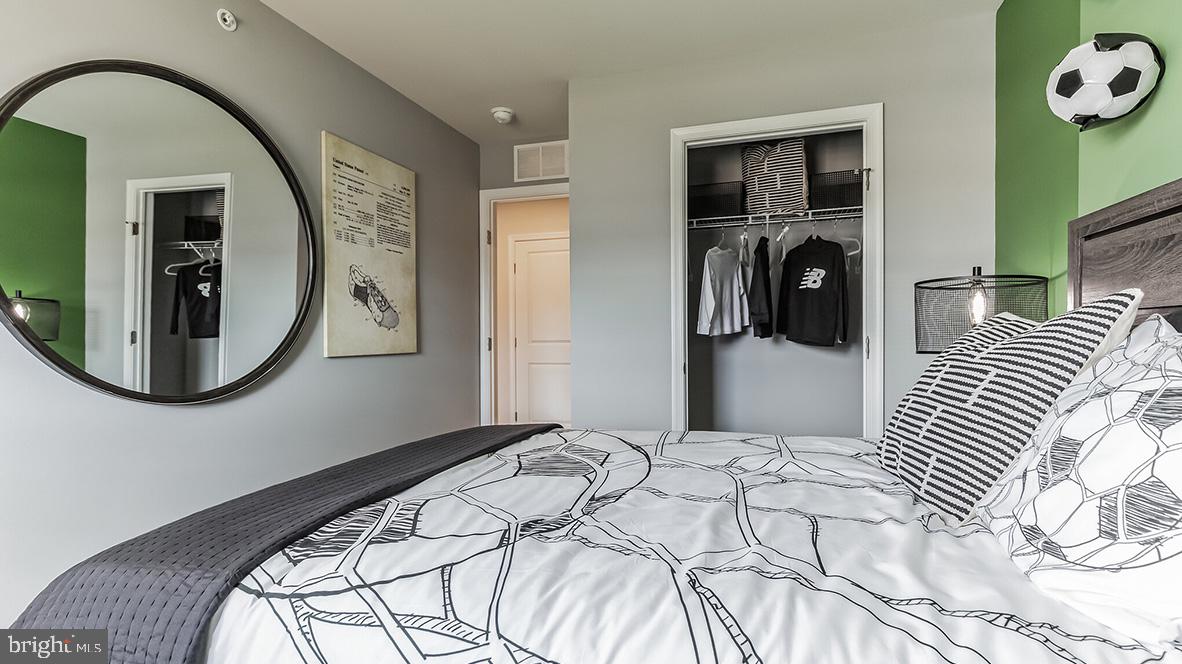 1162 Martin Road Breinigsville, PA 18031 - Photo 21 of 25 a bedroom with a bed and a mirror