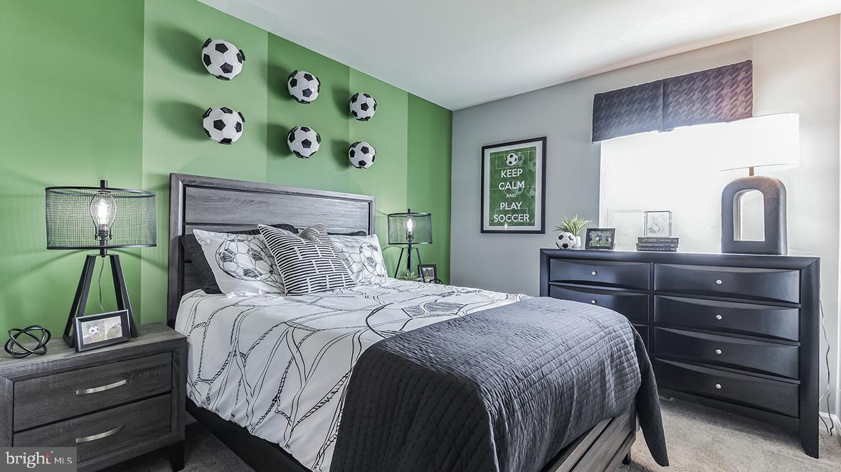 1162 Martin Road Breinigsville, PA 18031 - Photo 22 of 25 a bedroom with a bed and a dresser in it