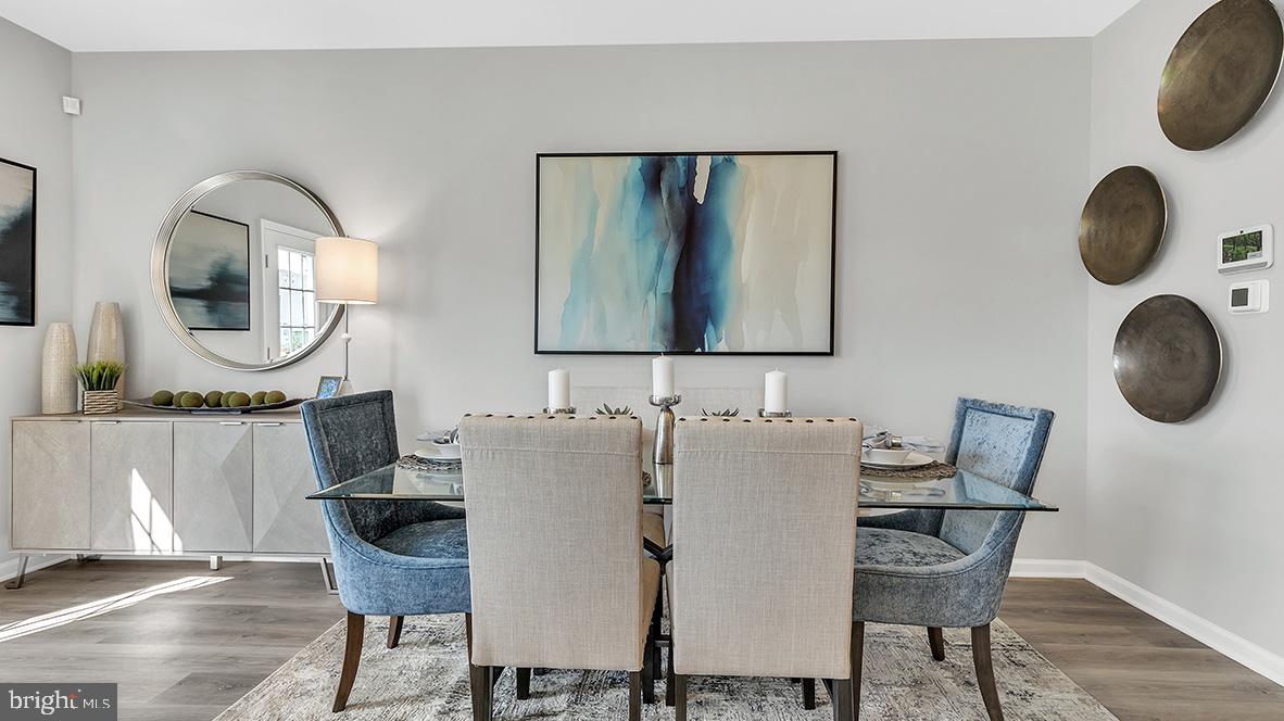 1162 Martin Road Breinigsville, PA 18031 - Photo 6 of 25 a view of a dining room with furniture and mirror