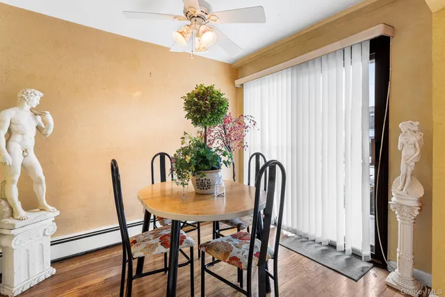 a view of a dining room with furniture and window