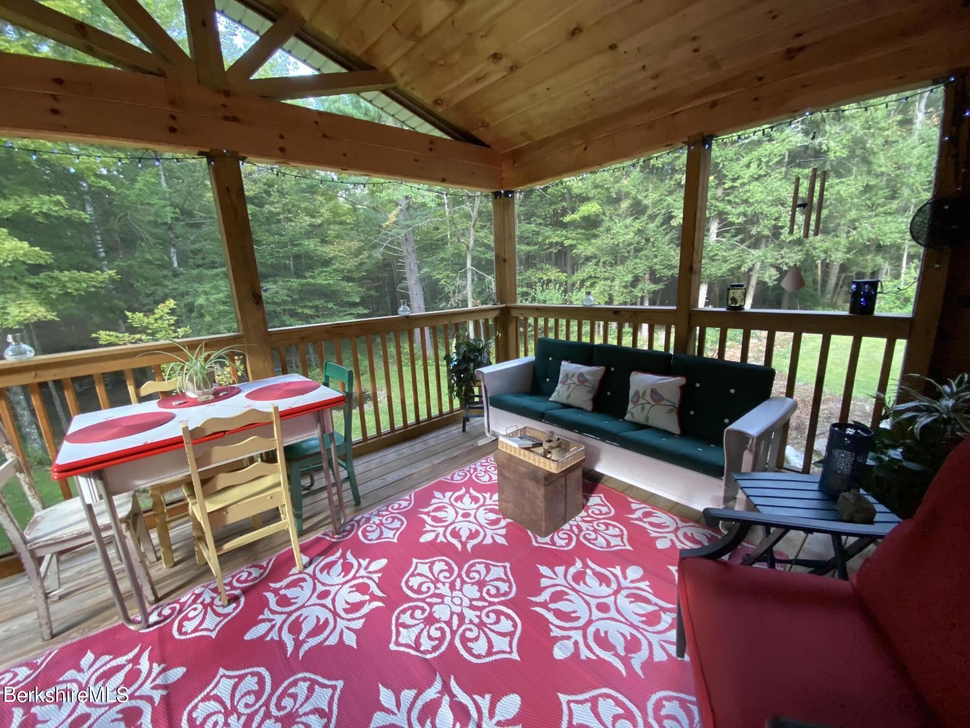 1196 Bancroft Road Becket, MA 01223 - Photo 19 of 46 dining space on the porch