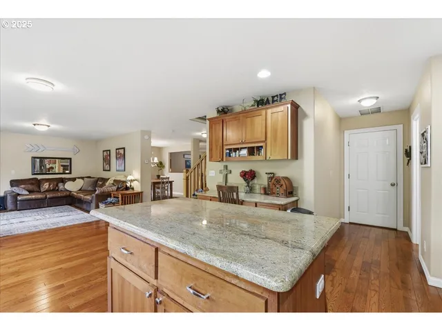 a kitchen with sink refrigerator and microwave