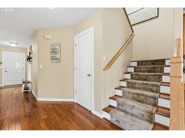 a view of an entryway with wooden floor