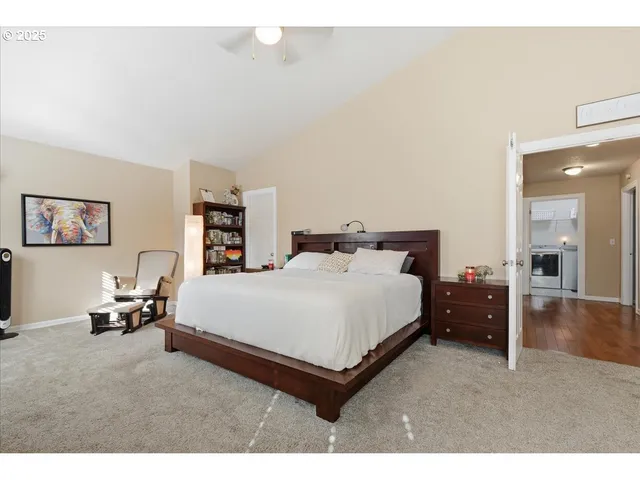 a bed room with a bed and a chair