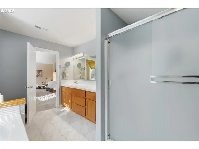 a view of walk in closet with clothes