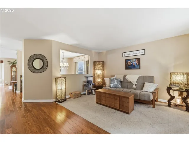 a living room with furniture and a mirror