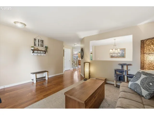a living room with furniture and a table