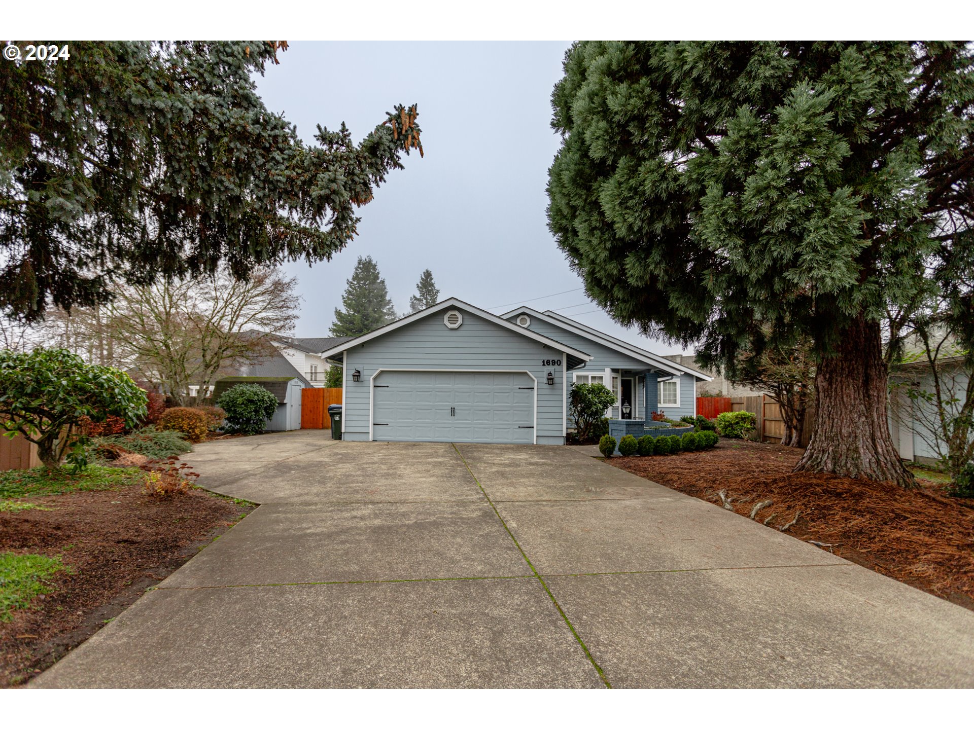 1690 Ridgley Boulevard Eugene, OR 97401 - Photo 1 of 30 a view of a house with a yard