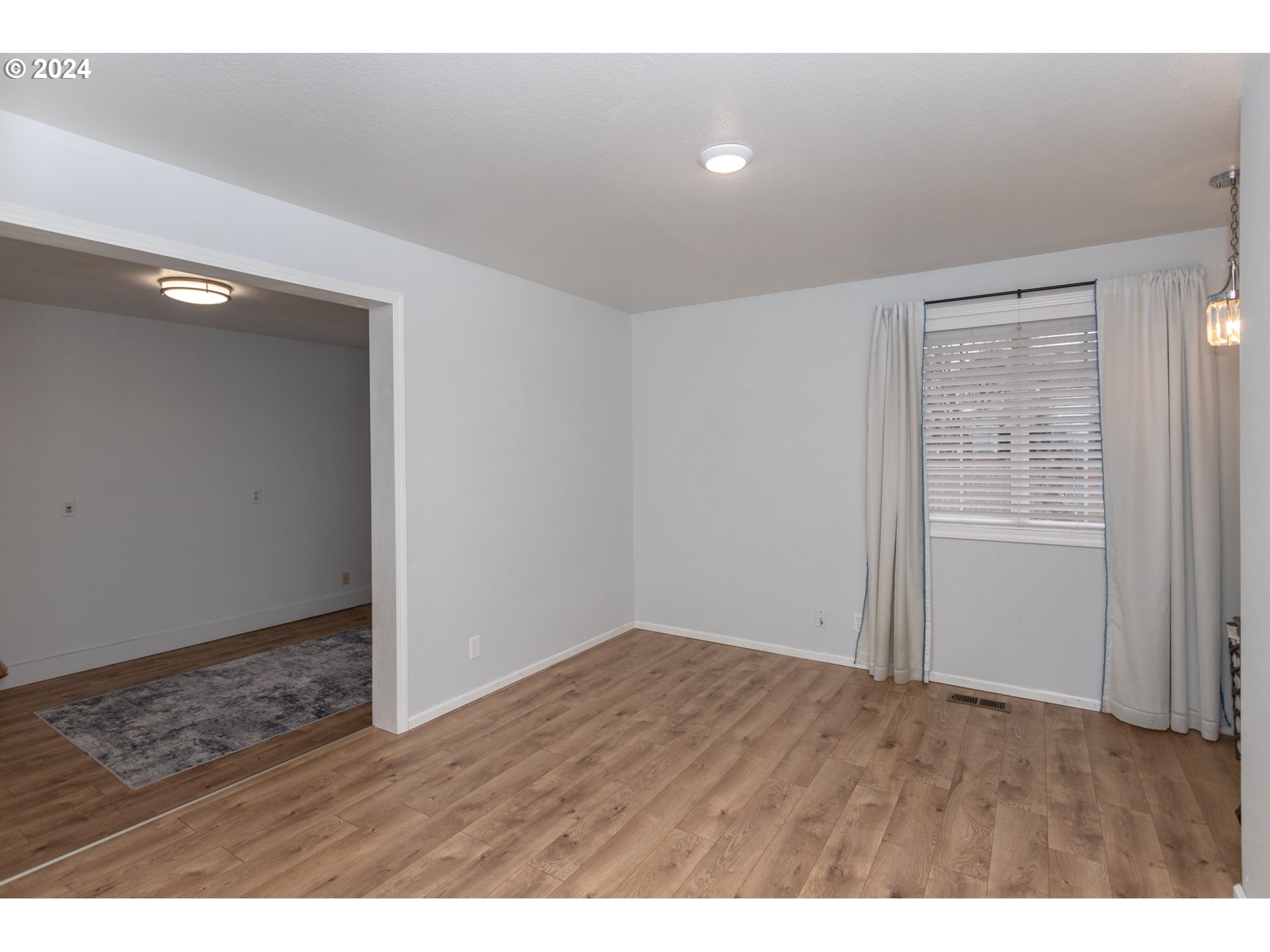 1690 Ridgley Boulevard Eugene, OR 97401 - Photo 16 of 30 an empty room with wooden floor and closet