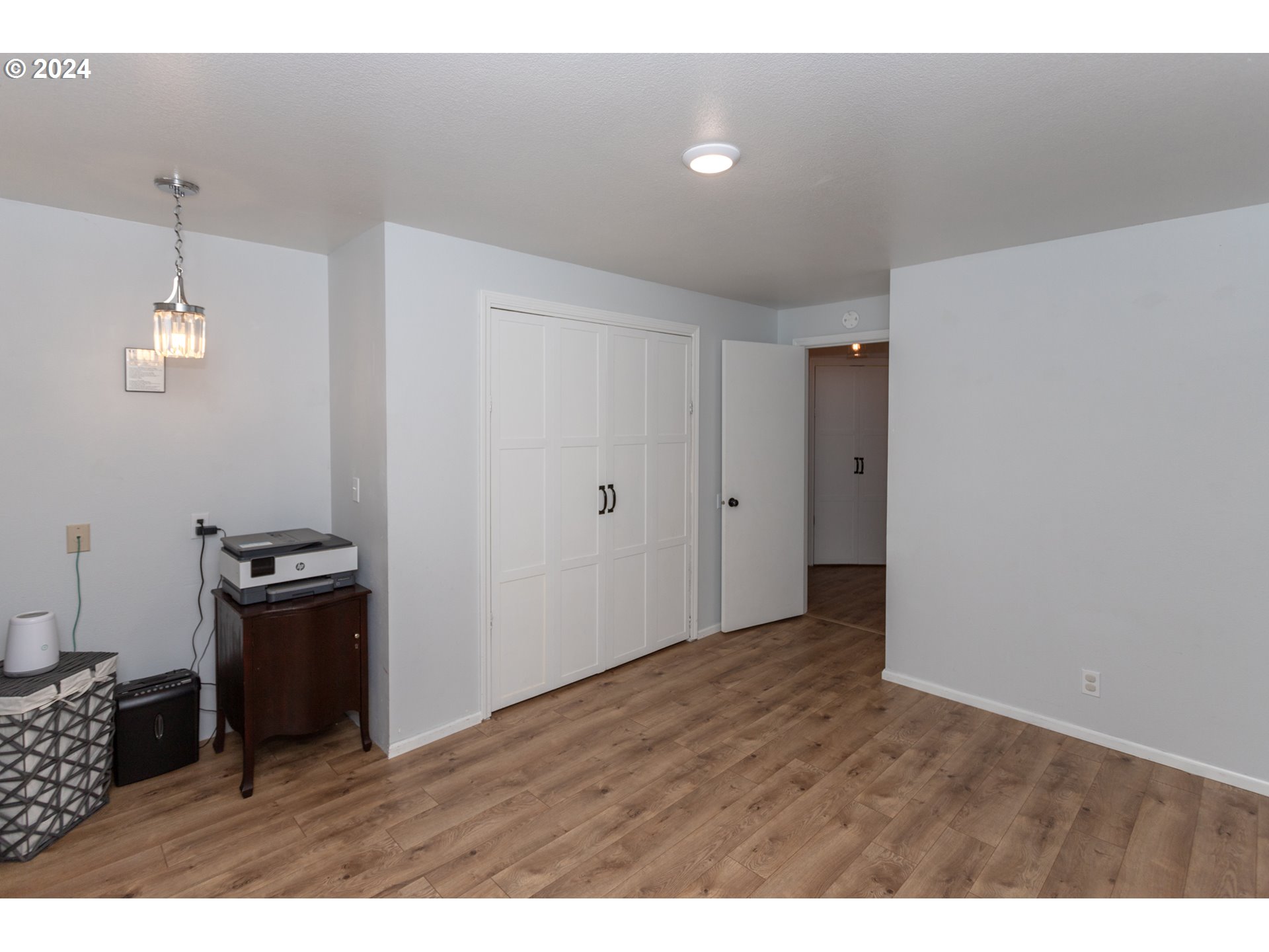 1690 Ridgley Boulevard Eugene, OR 97401 - Photo 20 of 30 a view of an empty room and wooden floor