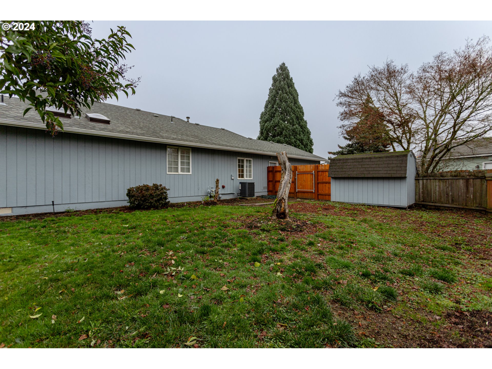 1690 Ridgley Boulevard Eugene, OR 97401 - Photo 29 of 30 a front view of a house with a garden