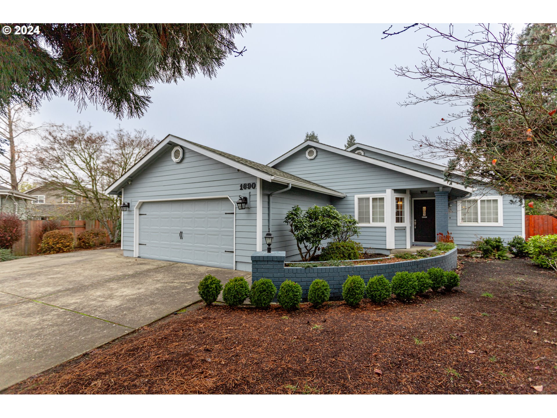 1690 Ridgley Boulevard Eugene, OR 97401 - Photo 4 of 30 a view of a yard in front of a house