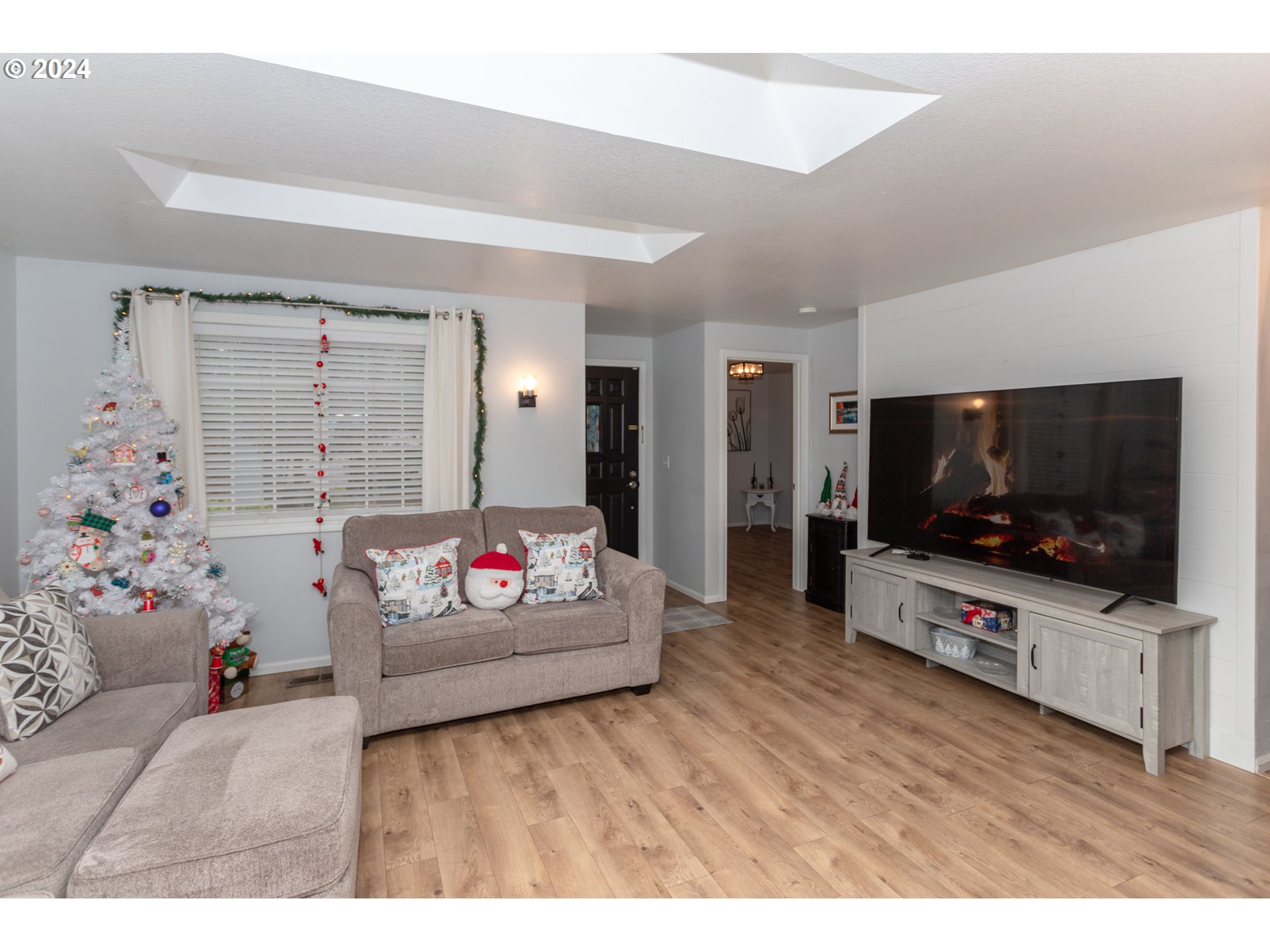 1690 Ridgley Boulevard Eugene, OR 97401 - Photo 6 of 30 a living room with furniture and a flat screen tv