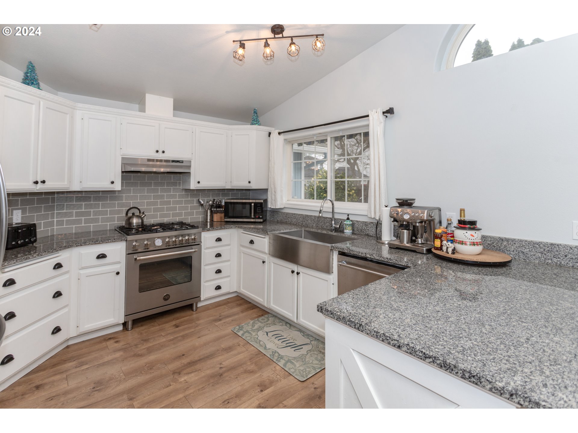 1690 Ridgley Boulevard Eugene, OR 97401 - Photo 8 of 30 a kitchen with sink a stove and cabinets