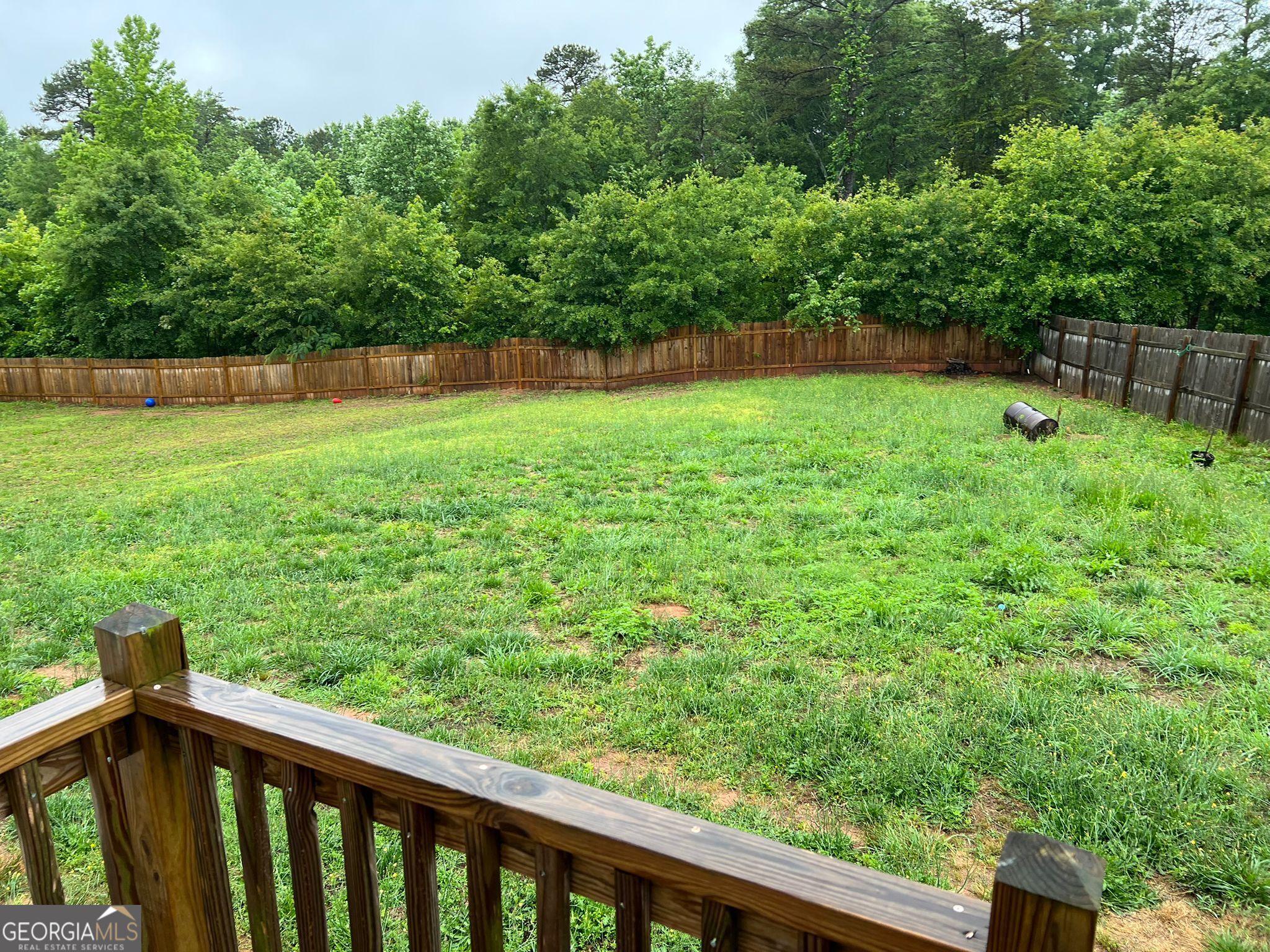126 Southgate Road Alto, GA 30510 - Photo 3 of 14 a view of a backyard with a wooden fence