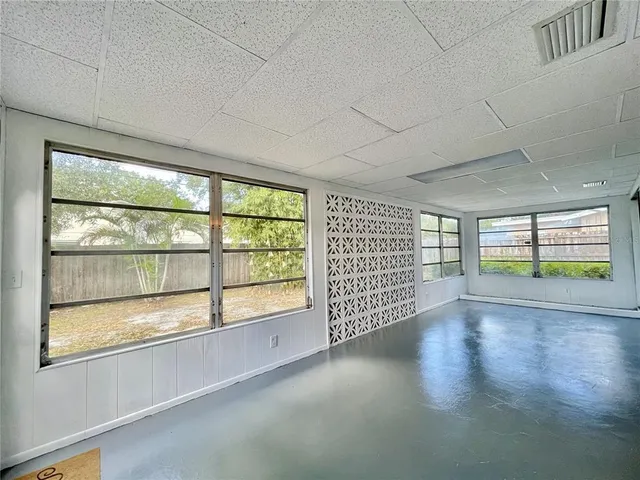 a view of an empty room with a large window