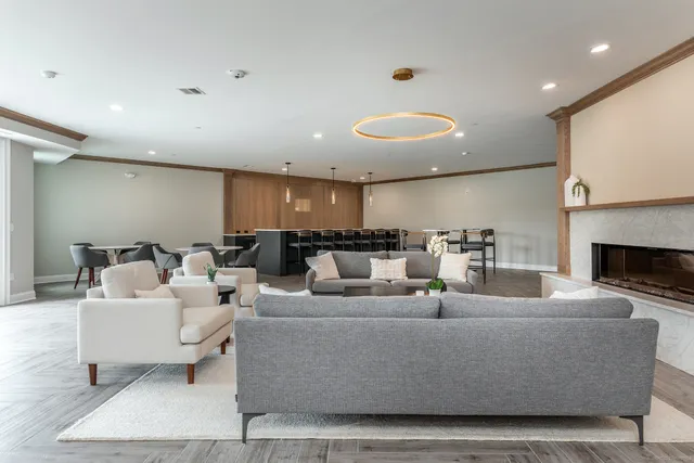 a living room with couches and a fireplace